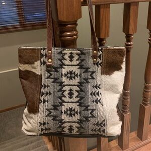 Myra Bag: shoulder bag, animal hide, canvas, textile weave.